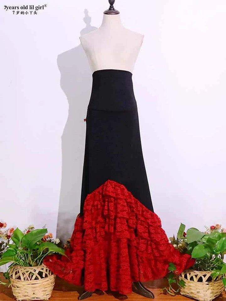 Elegant black and red lace Flamenco dance skirt for girls with V-shaped ruffled hem.