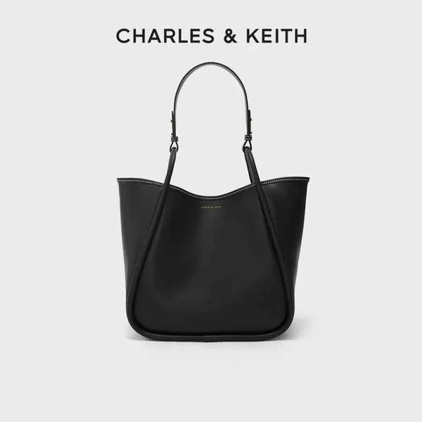 large black CHARLES & KEITH shoulder bag made of faux leather with adjustable strap and minimalist design