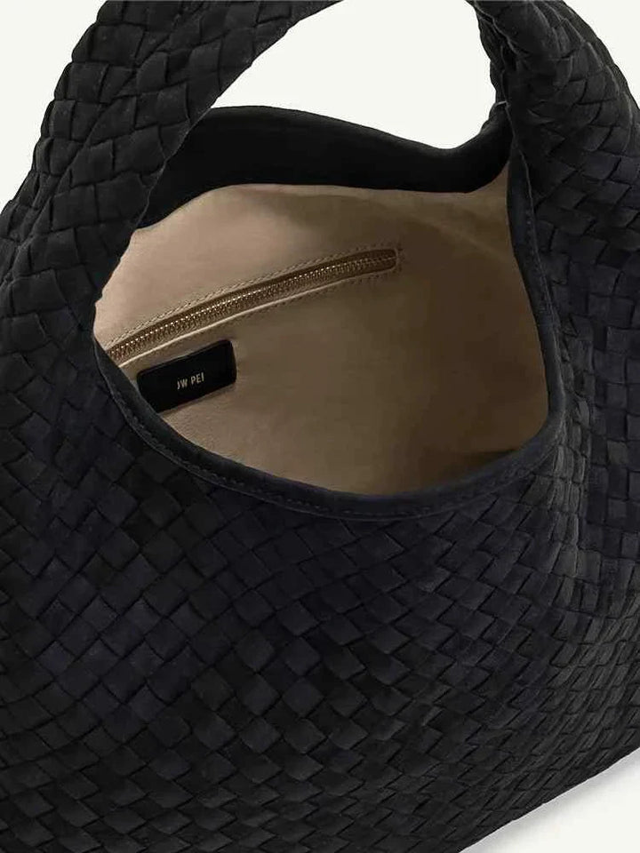 black large capacity woven bag with beige interior and zipper pocket inside