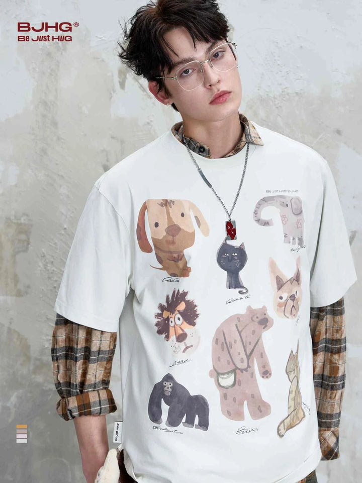 Young man wearing a white تيشيرت برسومات حيوانات with cartoon animal prints in casual style