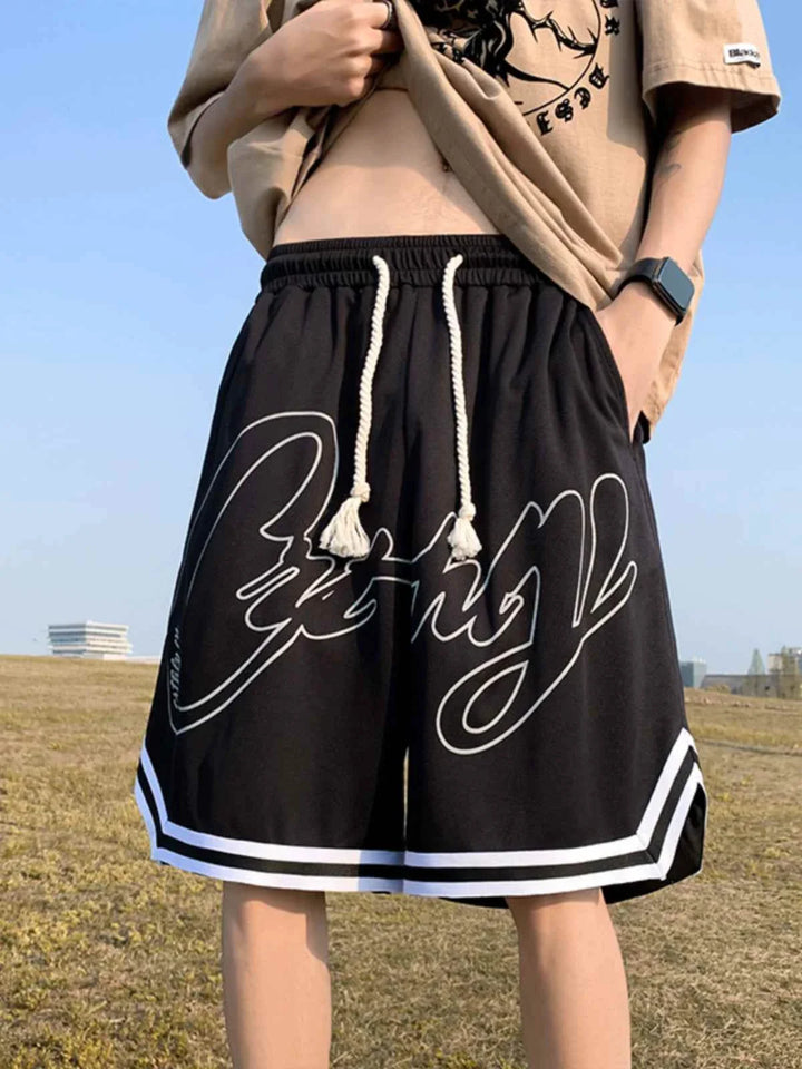 Black Ice Silk شورت رياضي with graffiti print, adjustable drawstring waist, and striped hem for casual and sporty wear
