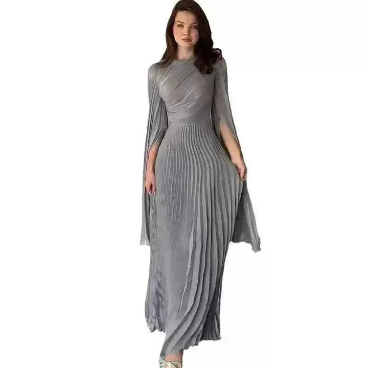 Elegant pleated gown with wide sleeves, suitable for evening events.