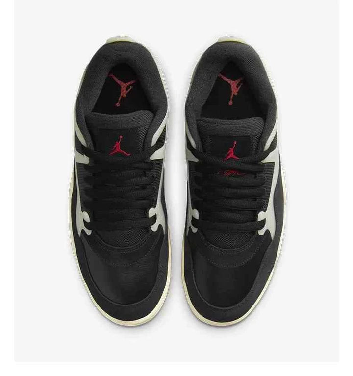 Air Jordan 4 RM sneakers in black with red accents, top view showing Max Air cushioning technology.