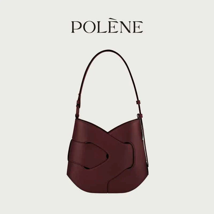 Maroon Polène Nodde Hobo bag in full grain smooth cowhide leather with adjustable shoulder strap and unique angular design.