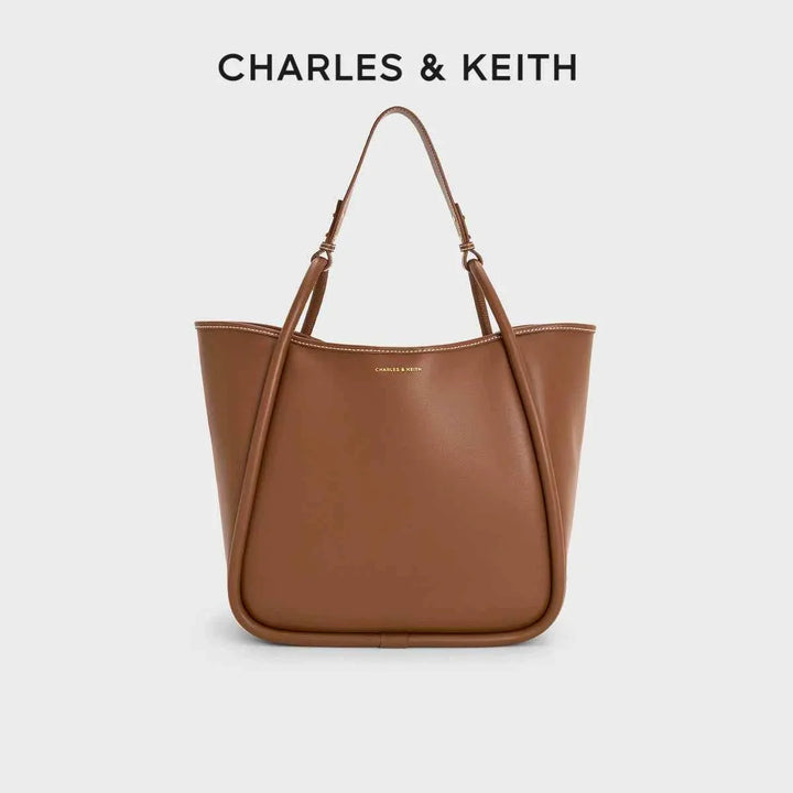 Large multicolor CHARLES & KEITH shoulder bag in brown faux leather with adjustable strap and spacious interior.