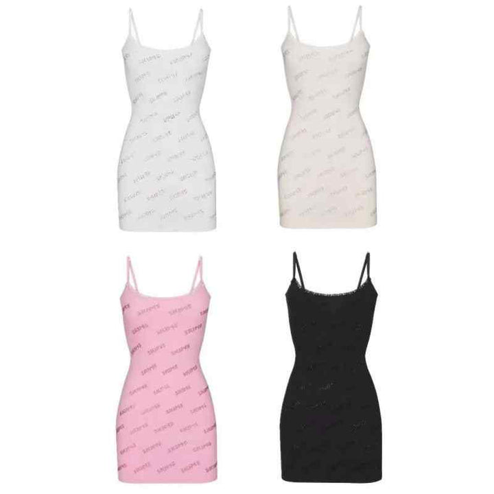 Four short Skims dresses with thin straps in white, beige, pink, and black colors, featuring the Skims logo print.