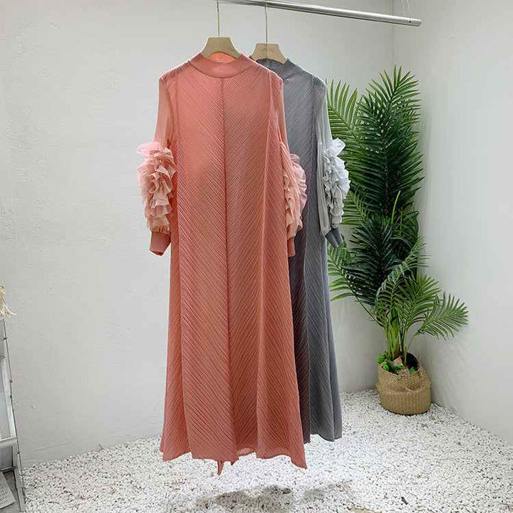 Loose floral sleeve dress with pressed pleats, available in solid colors.