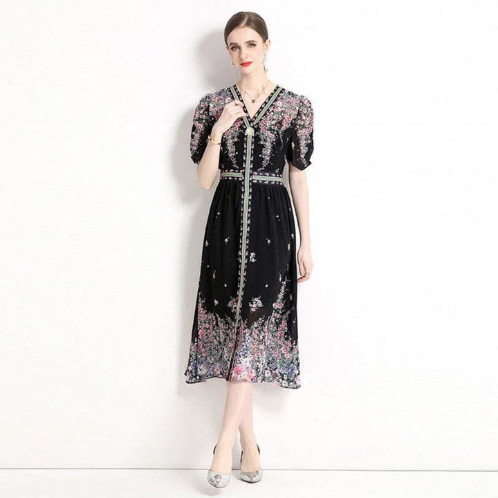 Elegant black chiffon dress with floral prints and V-neck, 2024 summer fashion.