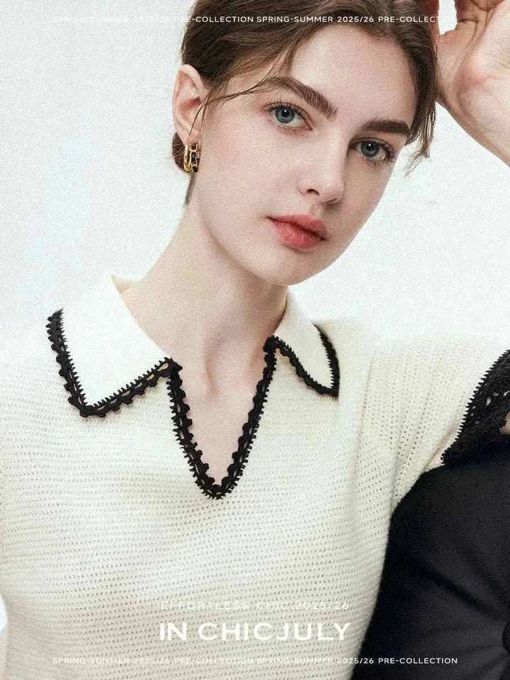 Woman wearing a white CHICJULY blouse with black decorative trim on collar and sleeves, featuring a V-neck design for spring-summer 2025/26 collection