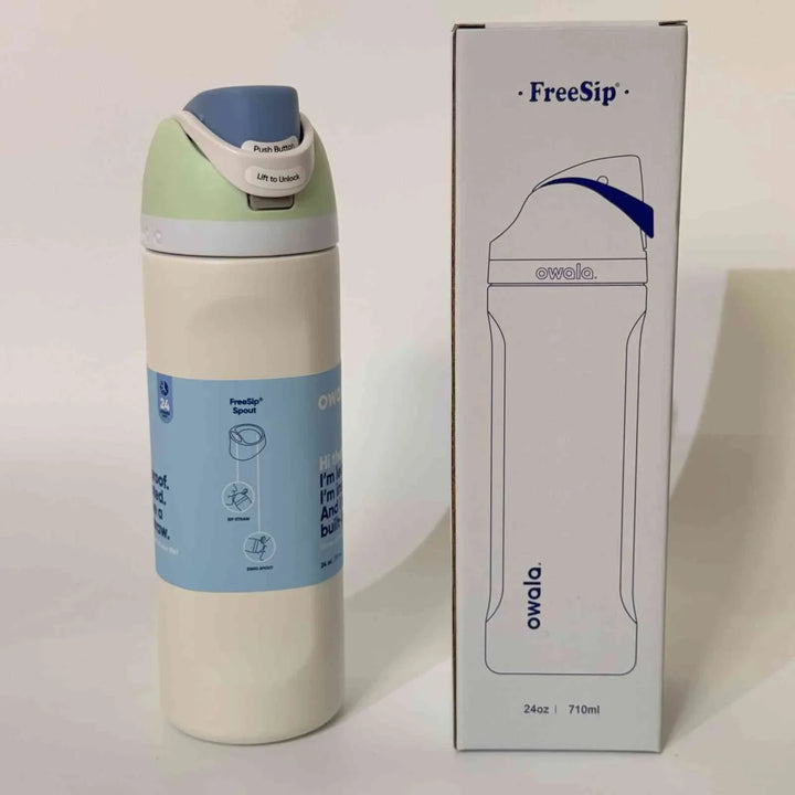 Owala FreeSip stainless steel water bottle with dual drinking spout and leak-proof design alongside its packaging box