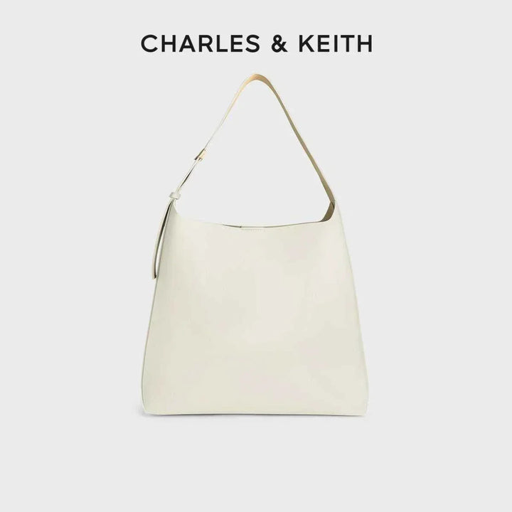 Minimalist cream CHARLES & KEITH shoulder bag with wide adjustable strap and magnetic closure