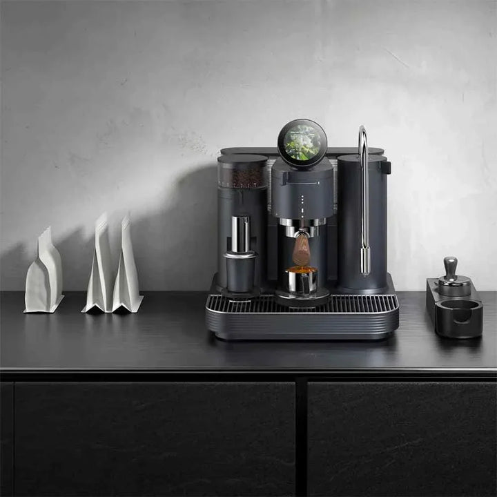 Espresso machine with dual boiler system and integrated grinder on a modern kitchen countertop.