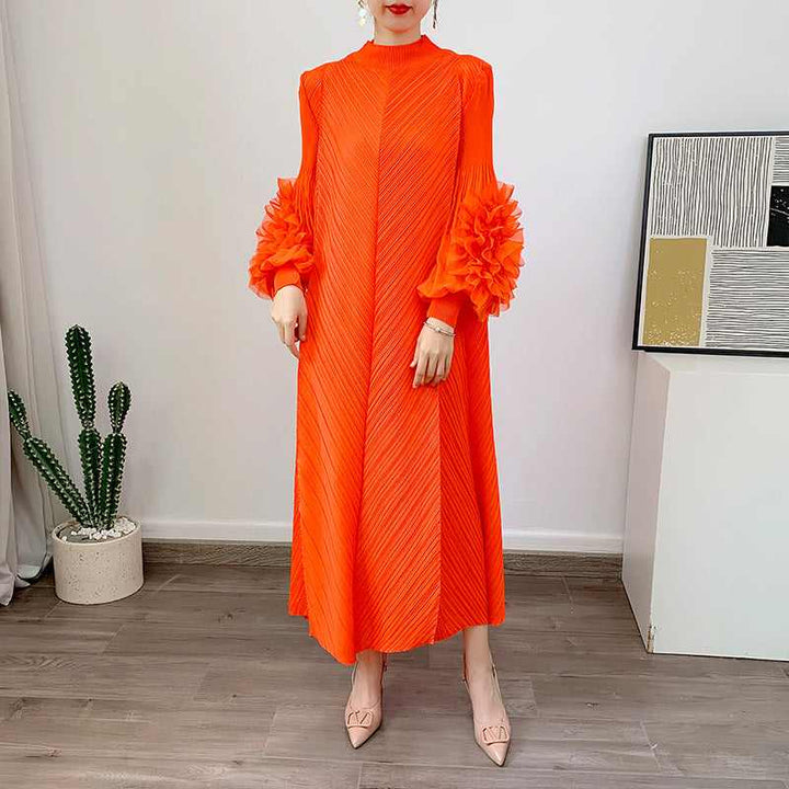 Loose-fitting orange dress with floral embellished sheer sleeves for an elegant look.