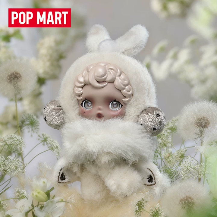 POPMART OSKULLPANDA collectible plush doll in white fuzzy costume with expressive eyes and intricate details, set in a natural floral background