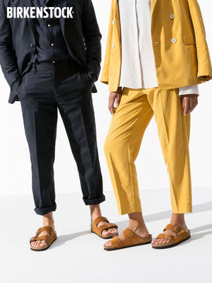 BIRKENSTOCK  Arizona double-buckle slippers.