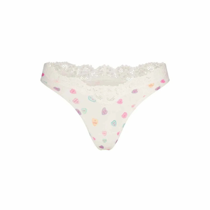 SKIMS FITS EVERYBODY white lace dipped thong with colorful heart prints, soft breathable polyamide fabric, elegant and comfortable lingerie brief