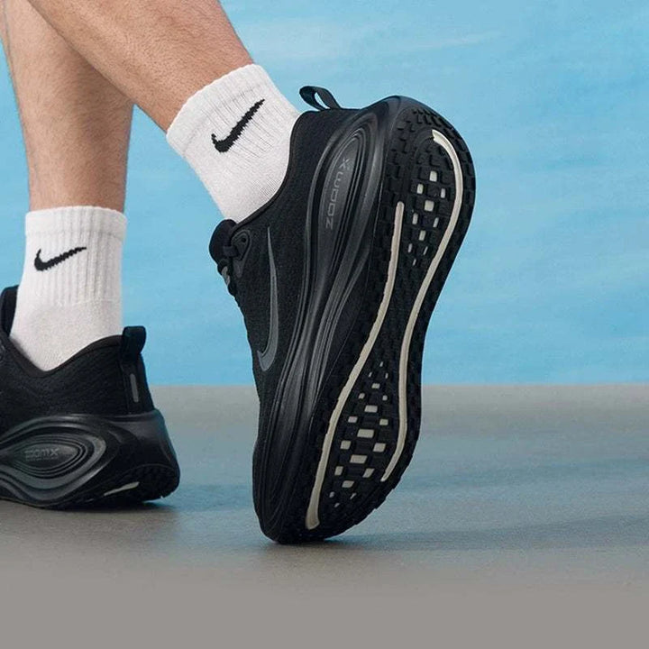 Nike Vomero Plus black running shoes with gray swoosh and ZoomX sole for comfort and durability