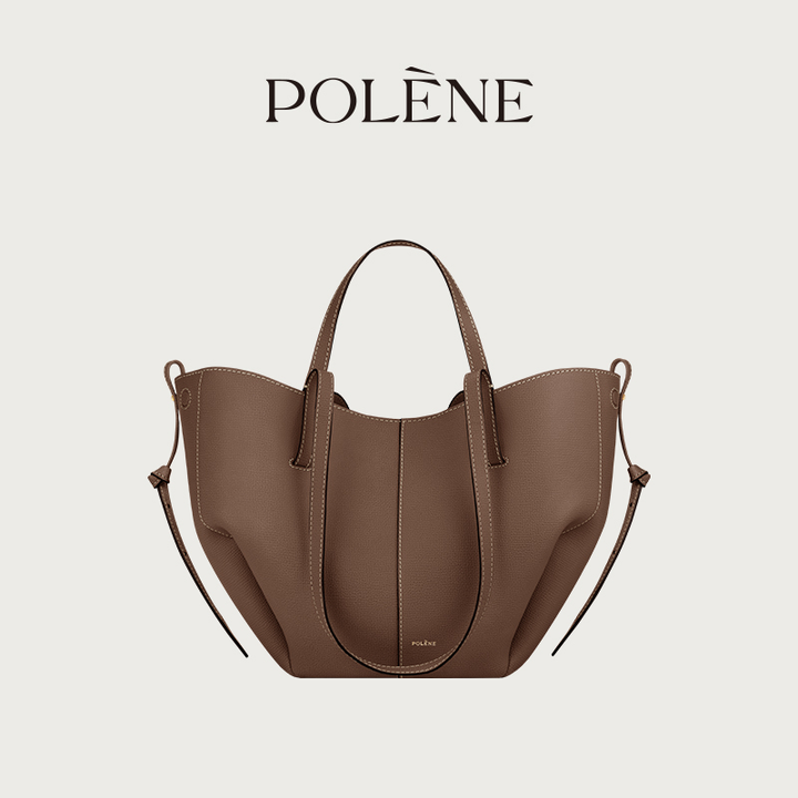 Polène Cyme Mini small tote bag in maroon leather with smooth curves and dual open or closed flower design.