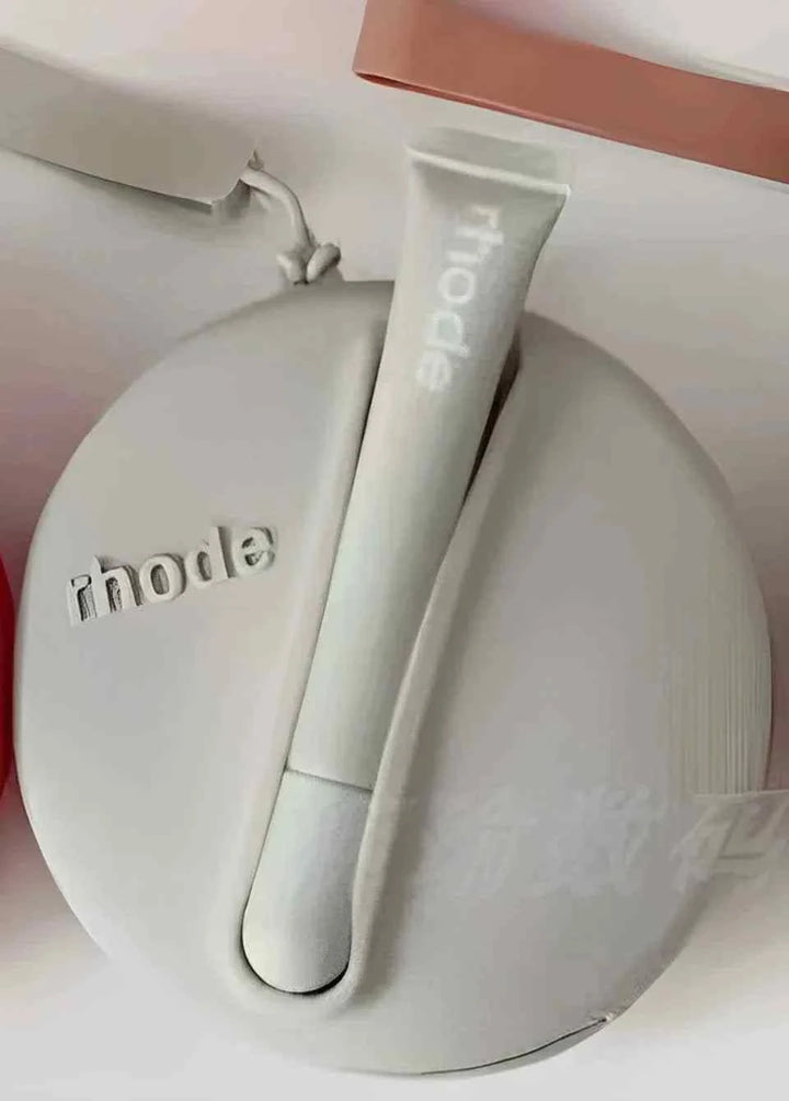 Rhode Peptide Lip Tint in sleek round silicone case with neutral beige shade, nourishing lip color with deep hydration and soft shine.