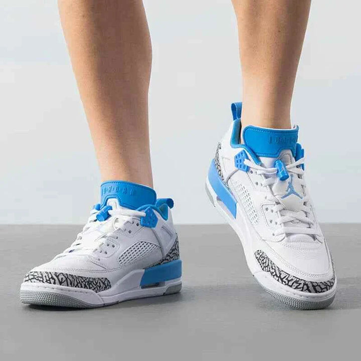 Nike men's JORDAN SPIZIKE LOW sneakers in white and university blue with iconic Jordan elements.