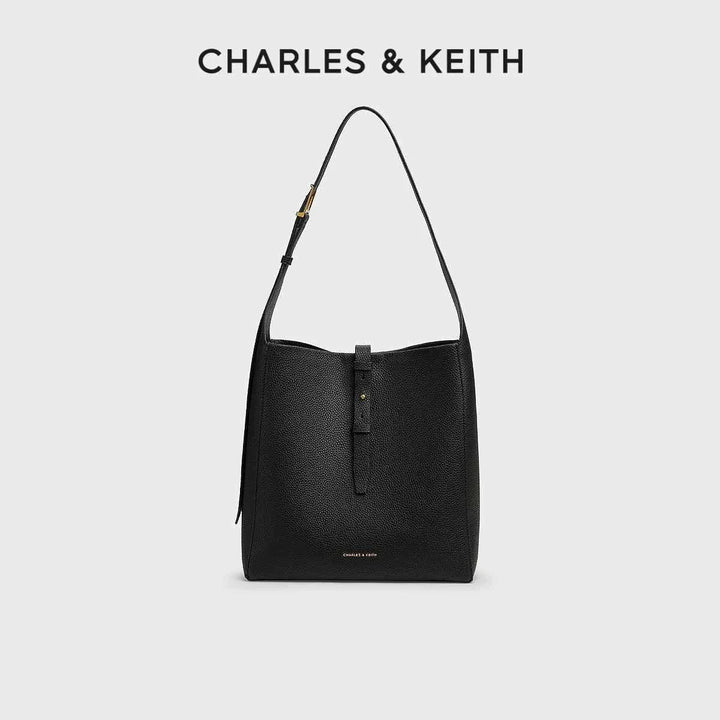 CHARLES KEITH black textured synthetic leather shoulder bag with adjustable strap and small inner pouch
