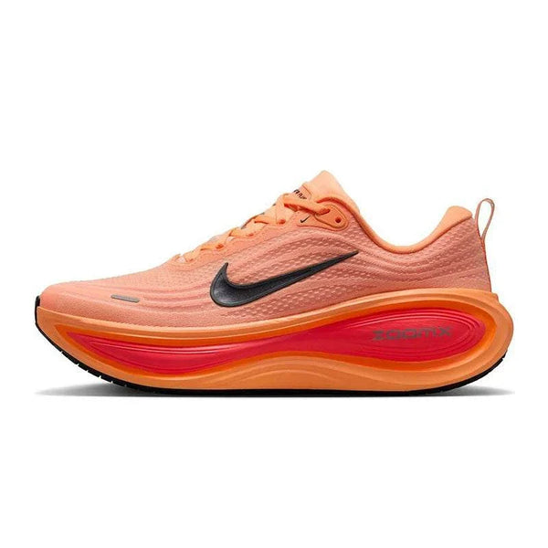 Nike VOMERO PLUS men's coral orange running shoe with black swoosh and ZoomX cushioning