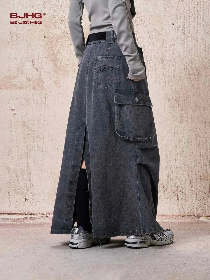 long dark washed denim cargo skirt with side pockets and wide cut styling
