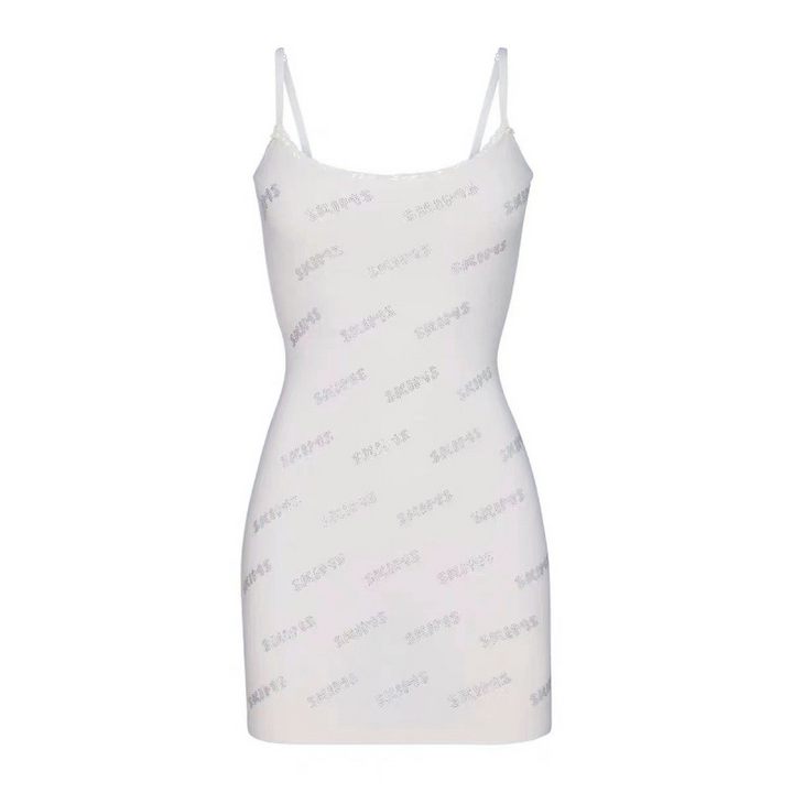 White Skims short dress with thin straps and iconic logo print, designed for comfort and elegance.