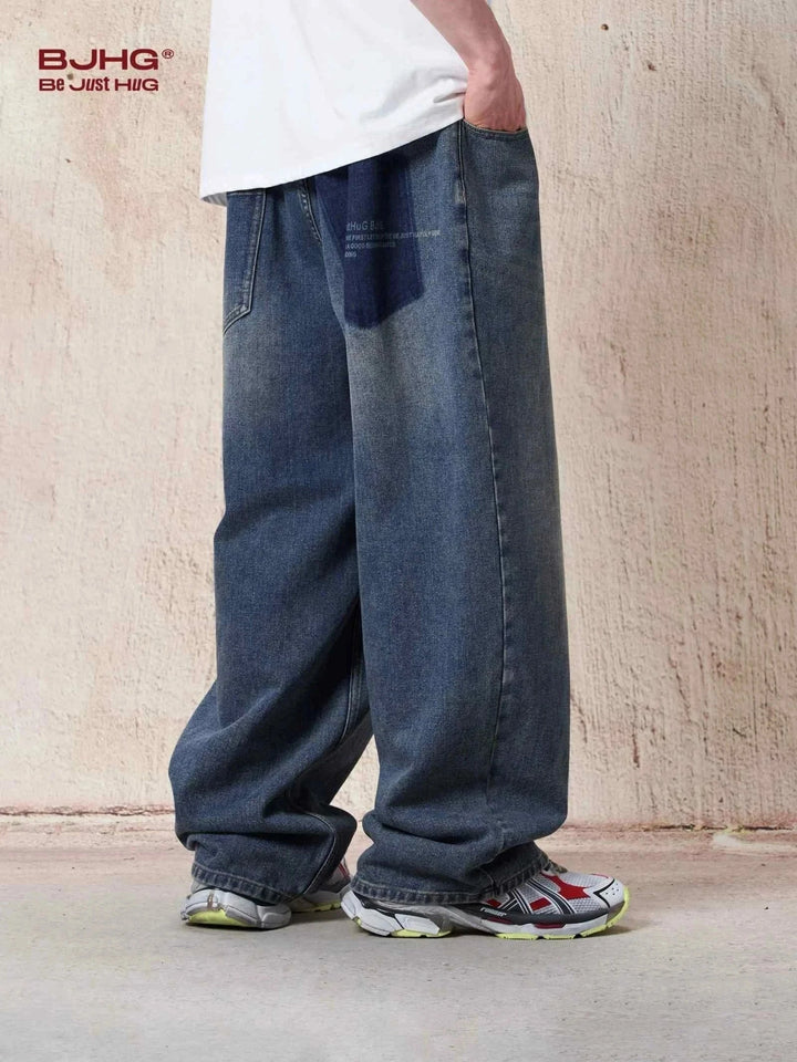 wide loose fit blue denim jeans with white drawstring waistband for casual style and comfort الب جينز