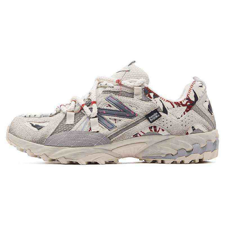 White and beige New Balance × PandaPrank limited edition sneaker with graffiti-inspired design and red accents