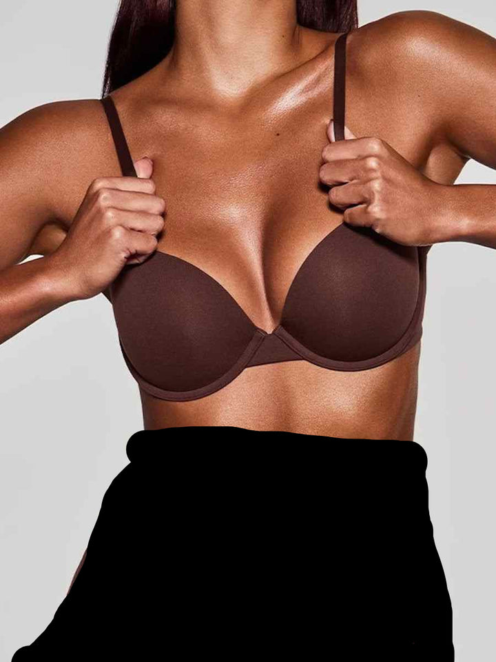soft supportive multicolor bra by SKIMS with smooth seamless design and adjustable straps in dark brown color