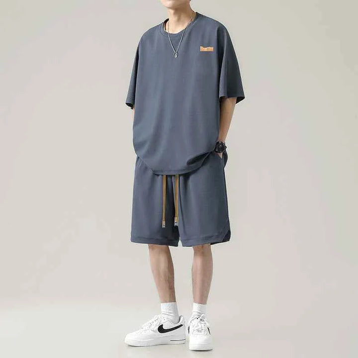 Men's Ice Silk set with loose t-shirt and practical shorts in dark gray, featuring a soft wrinkle-resistant fabric and adjustable waist drawstring.