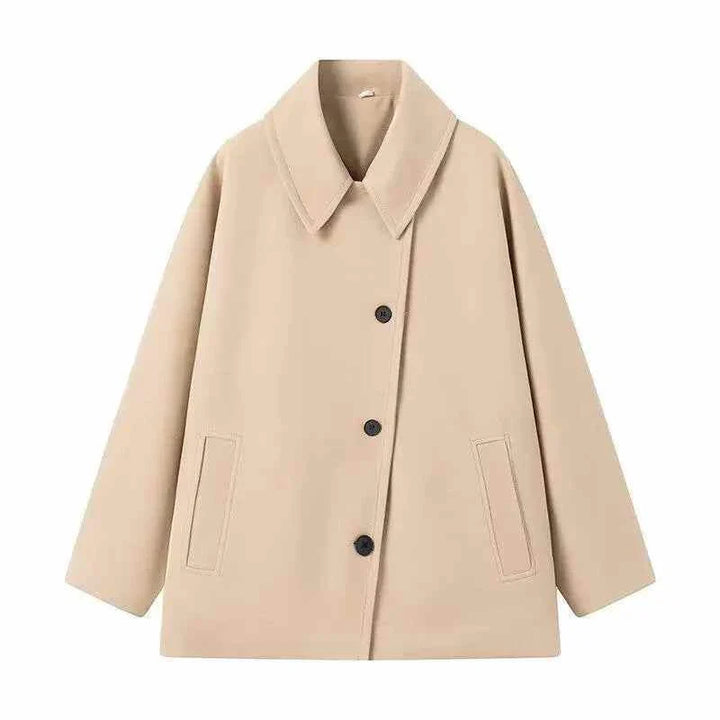 Beige oversized women's winter coat with front buttons and loose fit design for warmth and style