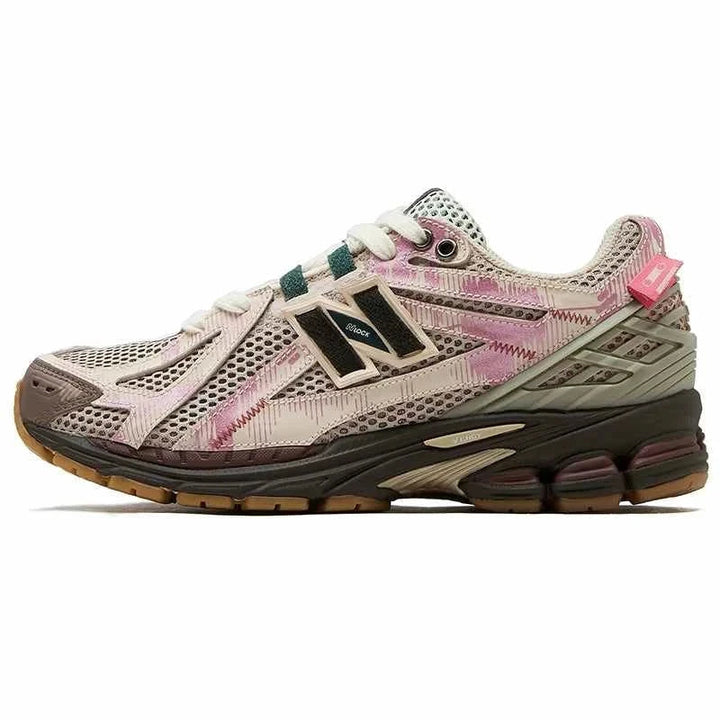 New Balance 1906R PandaPrank Limited Edition sneaker in beige, light pink, and dark green with artistic prints and advanced comfort technology.