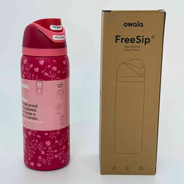 Owala Thermos CupKitty Limited Edition pink stainless steel insulated bottle with dual sipping options and leak-proof design next to its cardboard packaging box