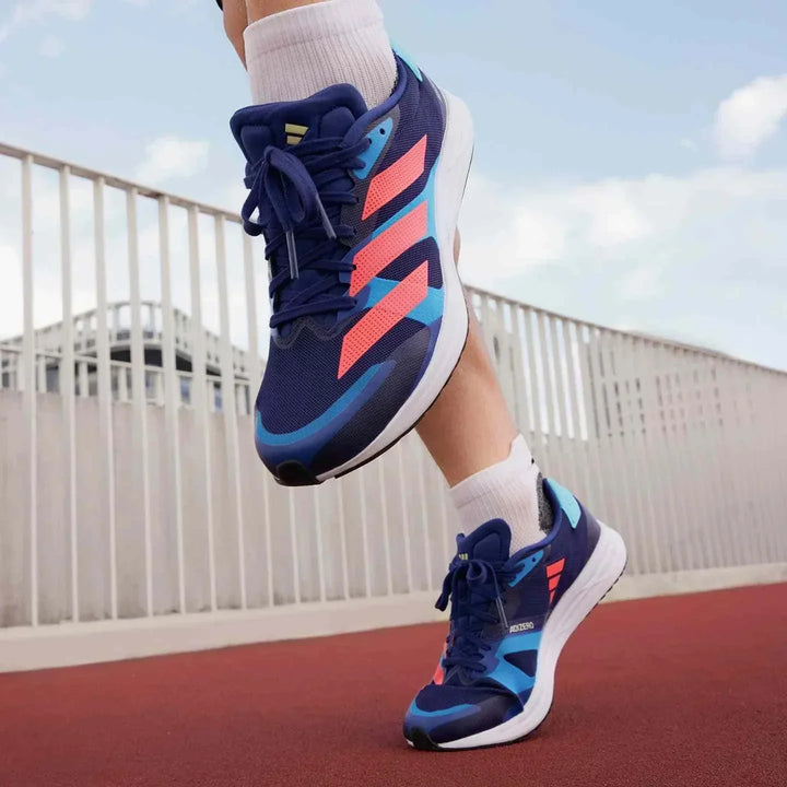 Adidas | أديداس حذاء Adizero RC 4 أزرق جري خفيف الوزن بتهوية عالية ونعل متوسط الاستجابة