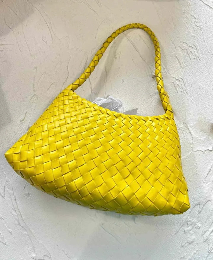 yellow dragon woven bag made of braided leather with a shoulder strap