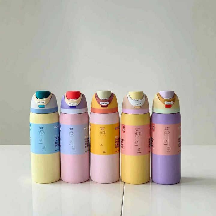 Set of colorful Owala FreeSip Cute Edition water bottles with leak-proof design and dual drinking spout.
