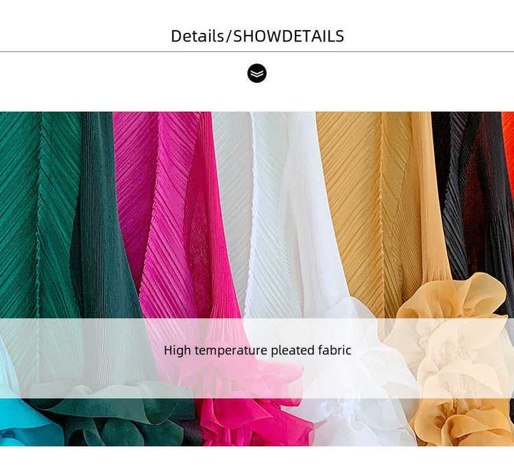 Solid color pleated fabric dresses in various vibrant shades.