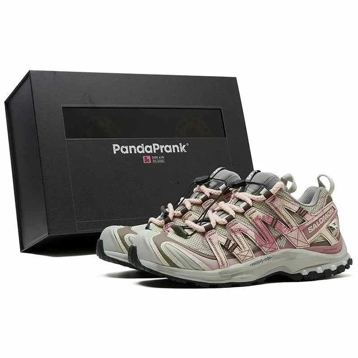 Salomon XA Pro 3D limited edition hiking shoes in beige and pink with Quicklace system and Contagrip sole next to a PandaPrank box