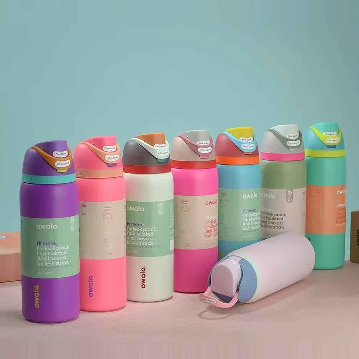 Colorful Owala Thermos CupKitty Limited Edition bottles with leak-proof lids and dual drinking options on a table
