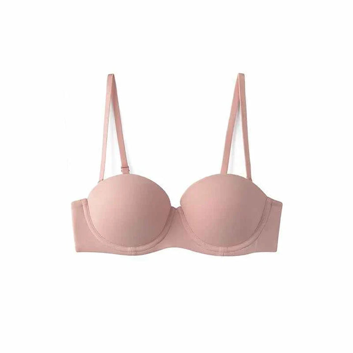 SKIMS Kardashian women's half cup bra in light pink with detachable straps and underwire support for a natural shape
