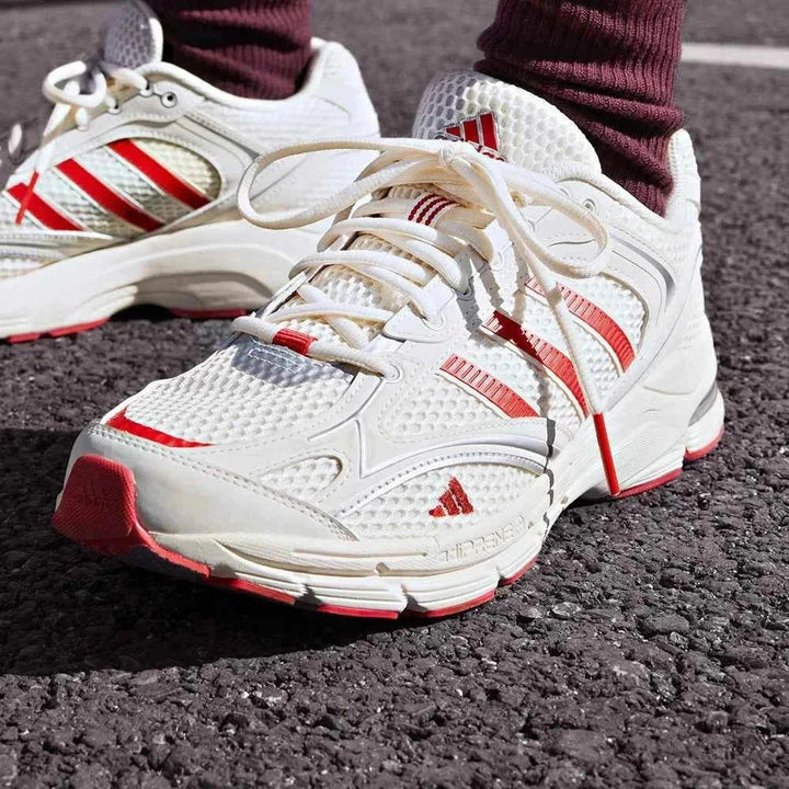 Adidas | أديداس حذاء SPIRITAIN 2.0 أبيض بشبكة وشرائط حمراء للأداء والراحة اليومية