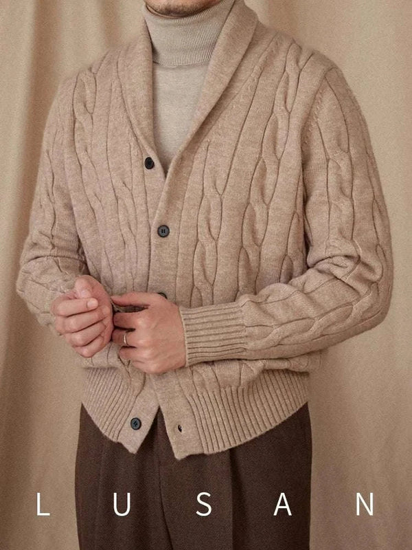 Mr. Lusan cardigan beige cable knit shawl collar with buttons and ribbed edges worn over turtleneck