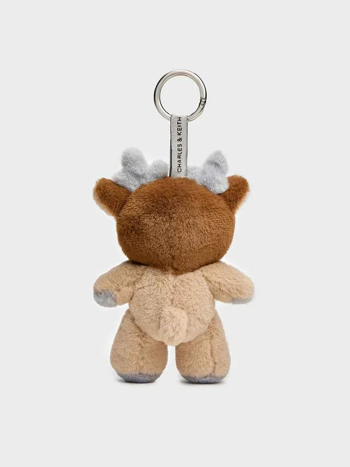 Soft plush Charles Keith bear keychain with small deer antlers and smiling face design