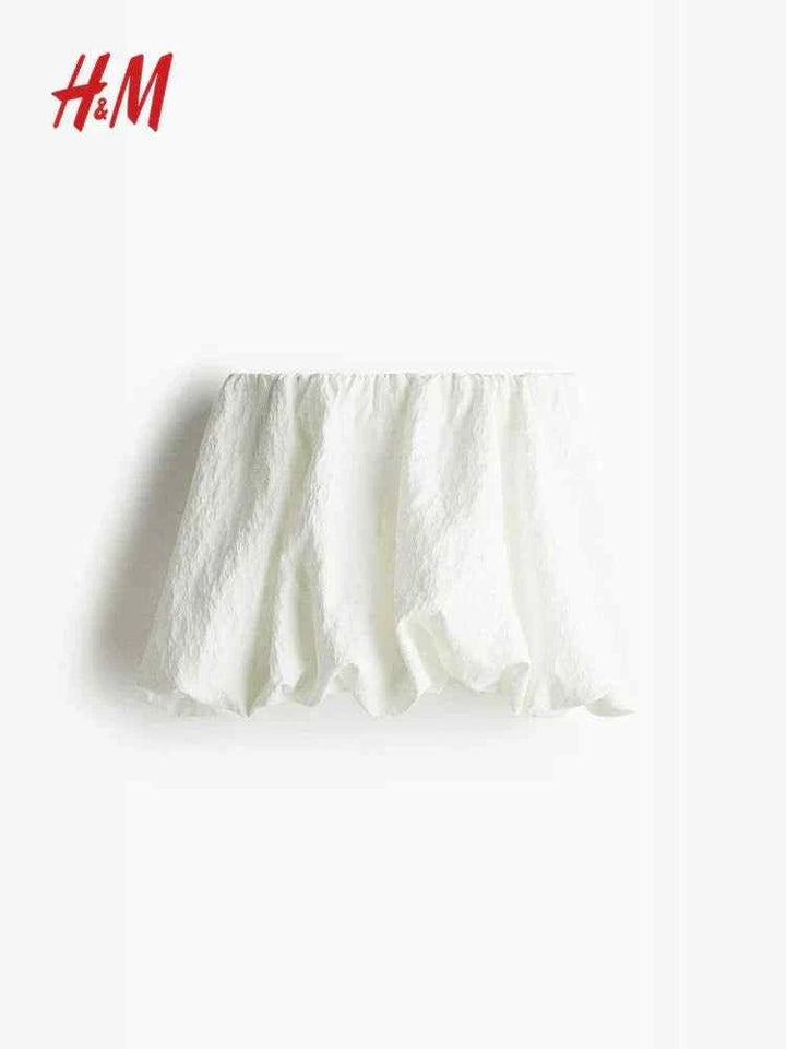 HM short skirt with bubble hem and gathered elastic waist in white.
