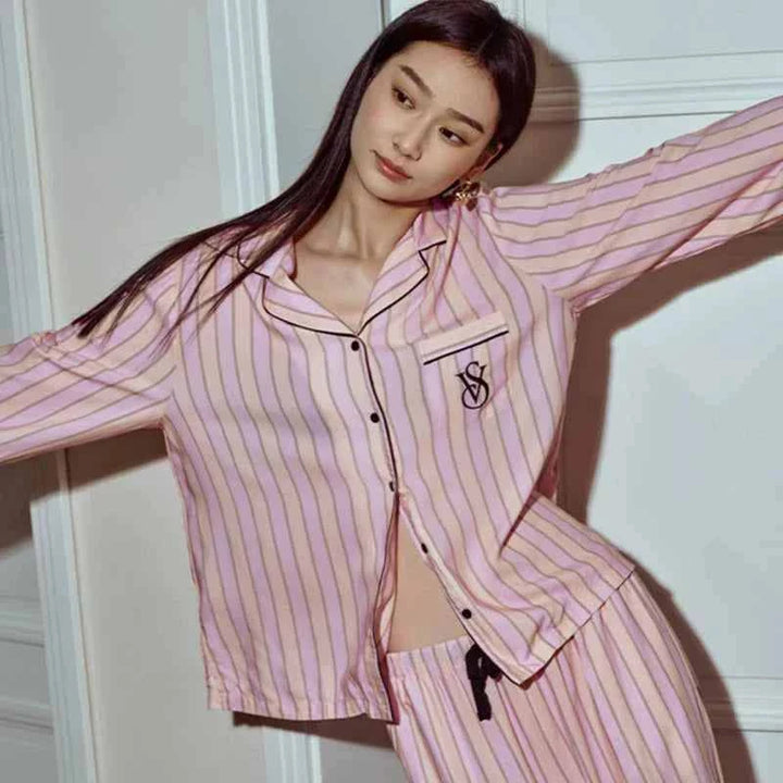 Woman wearing Victoria's Secret star staycation pink striped Tencel long sleeve loungewear pajamas