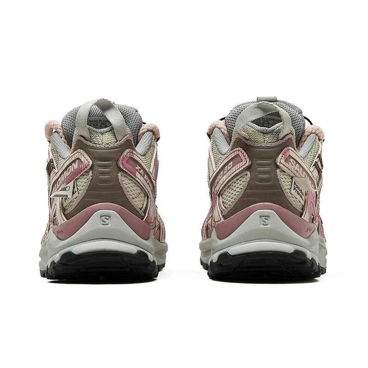 Rear view of Salomon XA Pro 3D PandaPrank Limited Edition hiking shoes in pink, beige, brown, and gray colors with Contagrip outsole and Quicklace system.