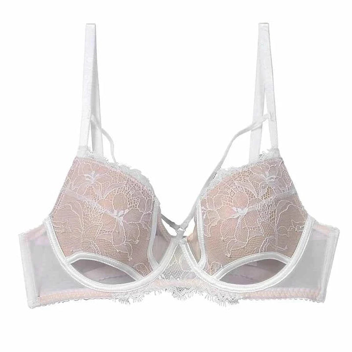 White Kardashian SKIMS gathered lace cutout lingerie bra with adjustable straps and breathable mesh sides.