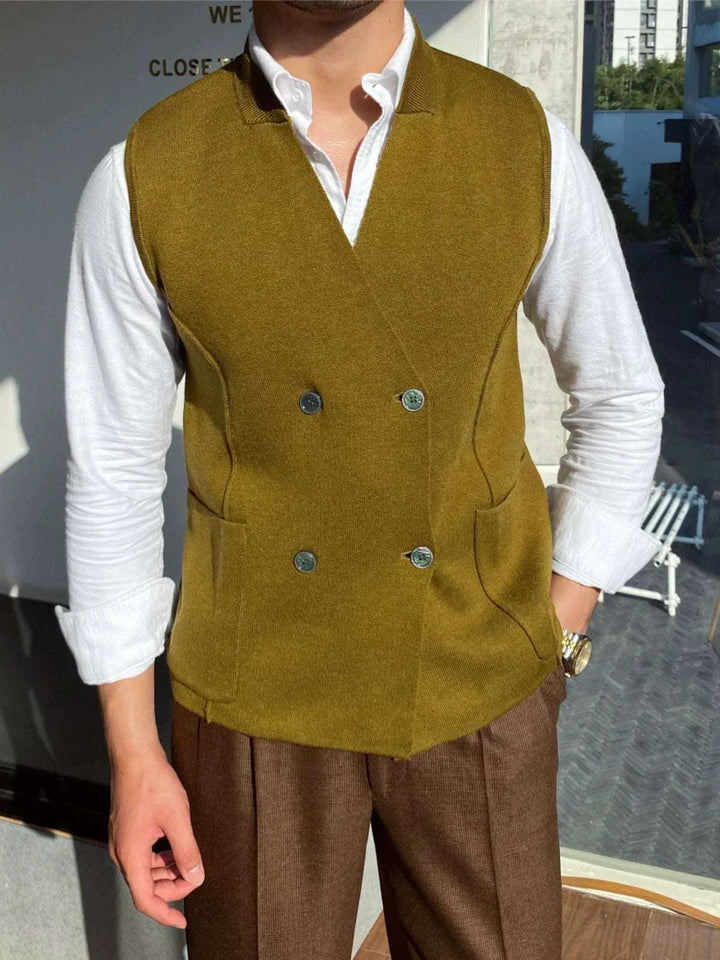 Mr. Lusan's British slim fit wool vest in olive green with double buttons and side pockets worn over white shirt